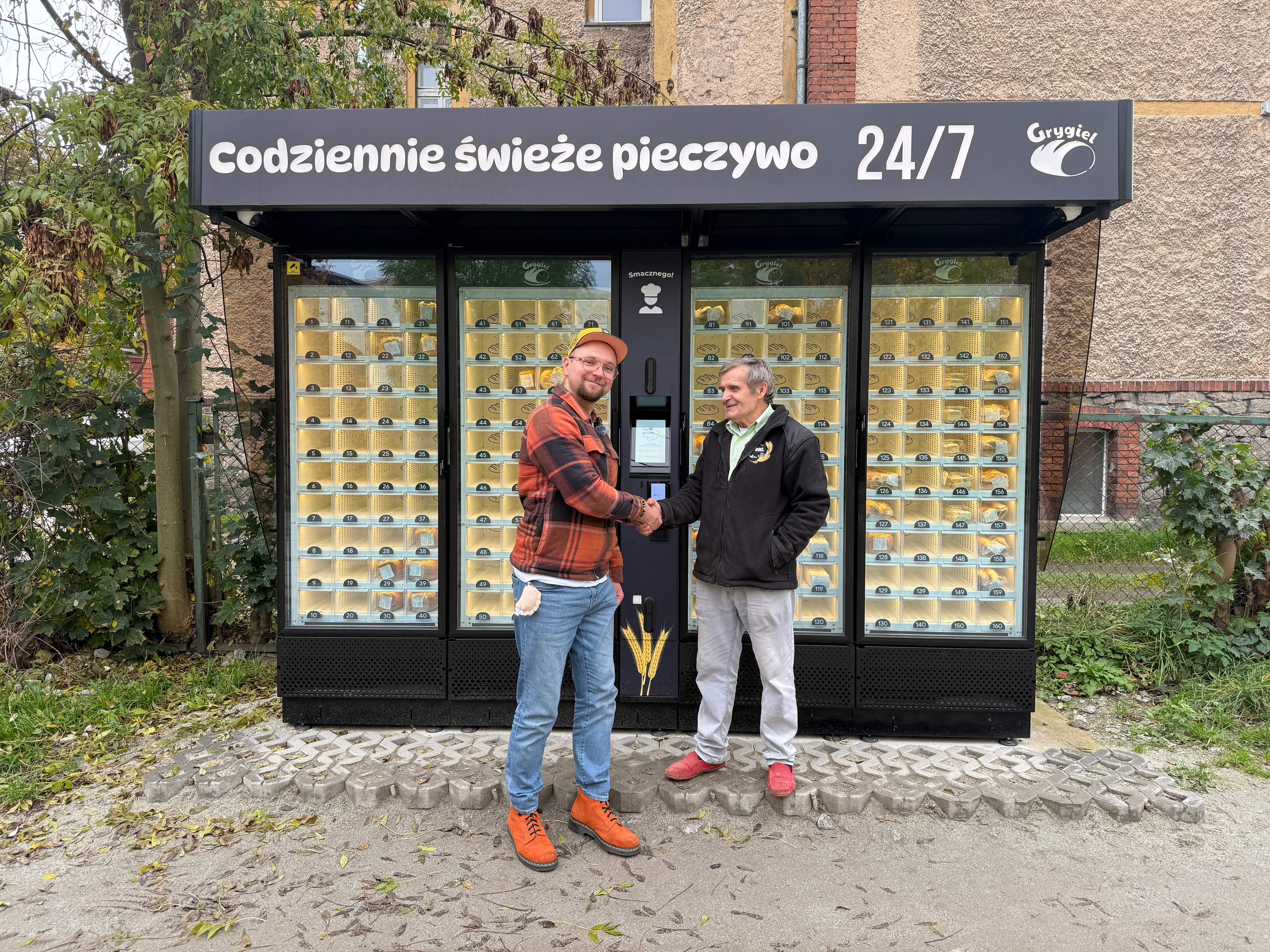 Grygiel bakery vending machine with two people in front